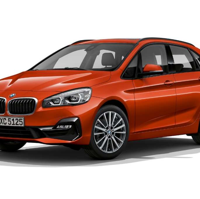 Three-quarter front view BMW 2 Series Active Tourer Model Sport Line BMW 2 Series Active Tourer Model Sport Line 220i F45 Sunset Orange metallic three-quarter front view