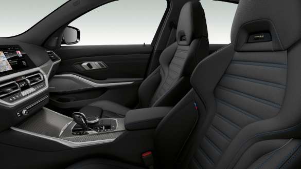 BMW 3 Series Sedan, sport seats. Close-up side view of the front row seats with black sport seats for driver and front passenger.