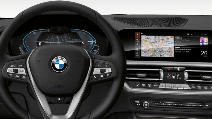 BMW 3 Series Sedan, 330e. Detailed frontal view of the BMW 3 Series Sedan cockpit with i-specific display.