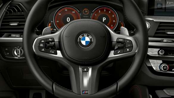 BMW X4 M40i Variable sport steering. BMW X4 M40i interior, cockpit, M leather steering wheel, Variable sport steering.