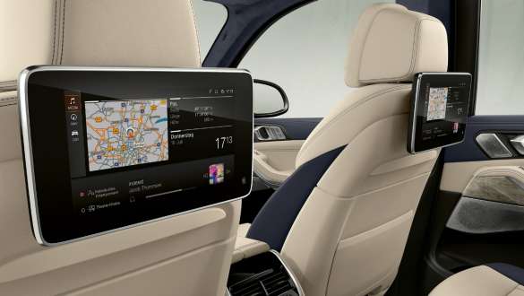 BMW X7 M Automobile with Rear-seat entertainment Professional BMW X7 M Automobile, interior, Slanted view of the Rear-seat entertainment Professional on the back of the front seats, G07
