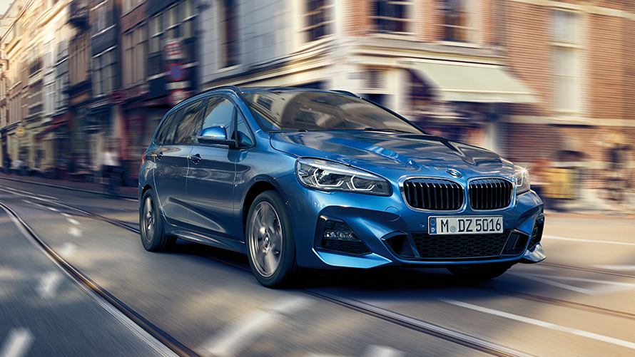 BMW 2 Series Gran Tourer F46 three-quarter front view driving on the street BMW 2 Series Gran Tourer F46 three-quarter front view driving on the street