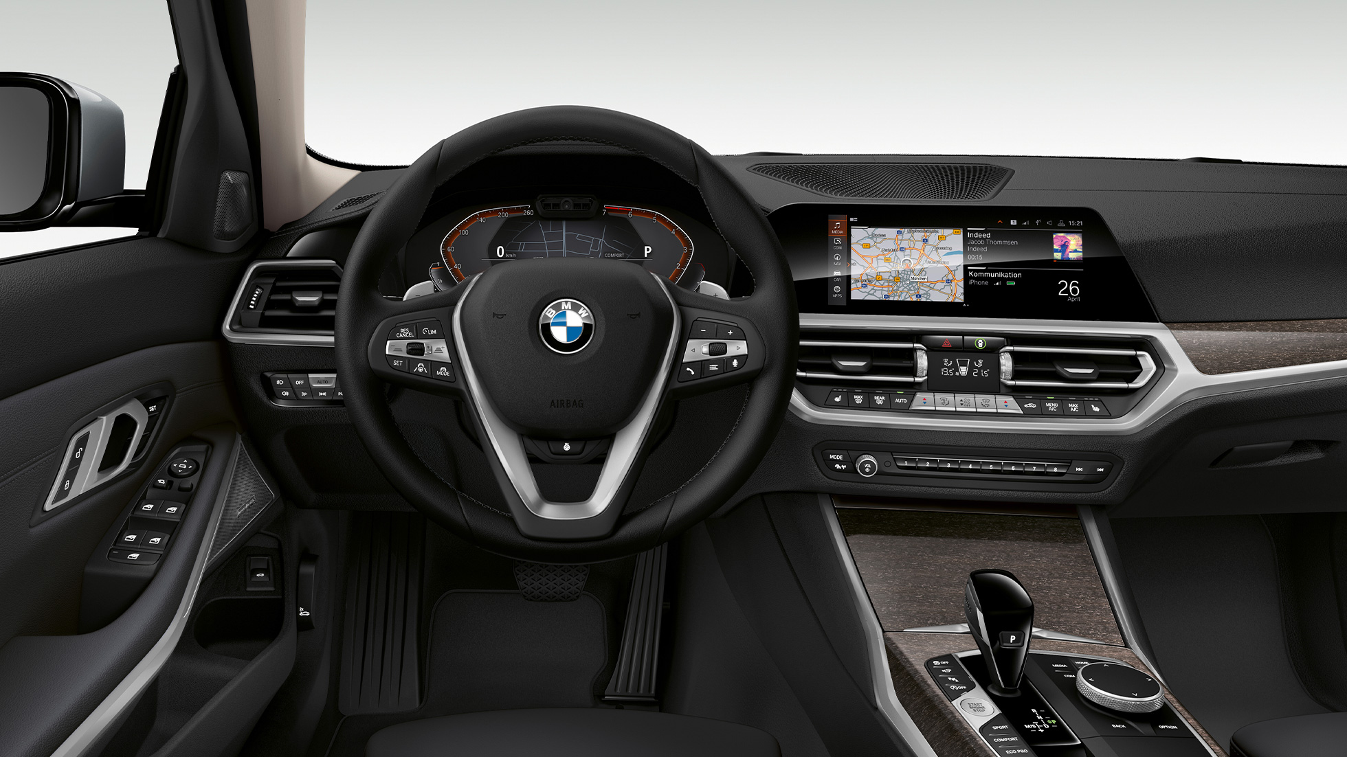 BMW 3 Series Sedan, Modell Luxury Line Cockpit. Frontal close-up of the driver's cockpit of the BMW 3 Series Sedan with Model Luxury Line features.