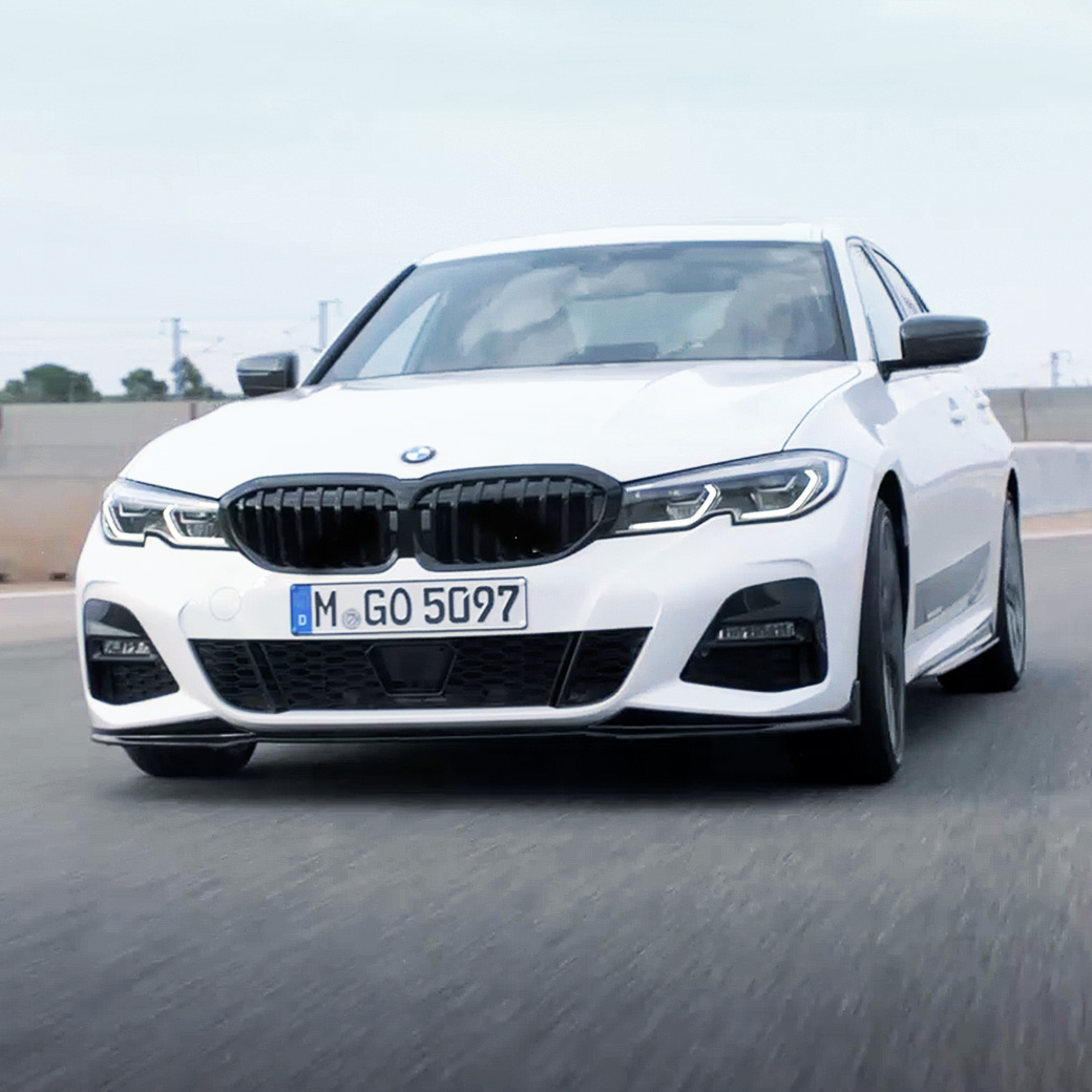 BMW 3 Series Sedan, M Performance parts. Quarter front view of the BMW 3 Series Sedan with M Performance parts.