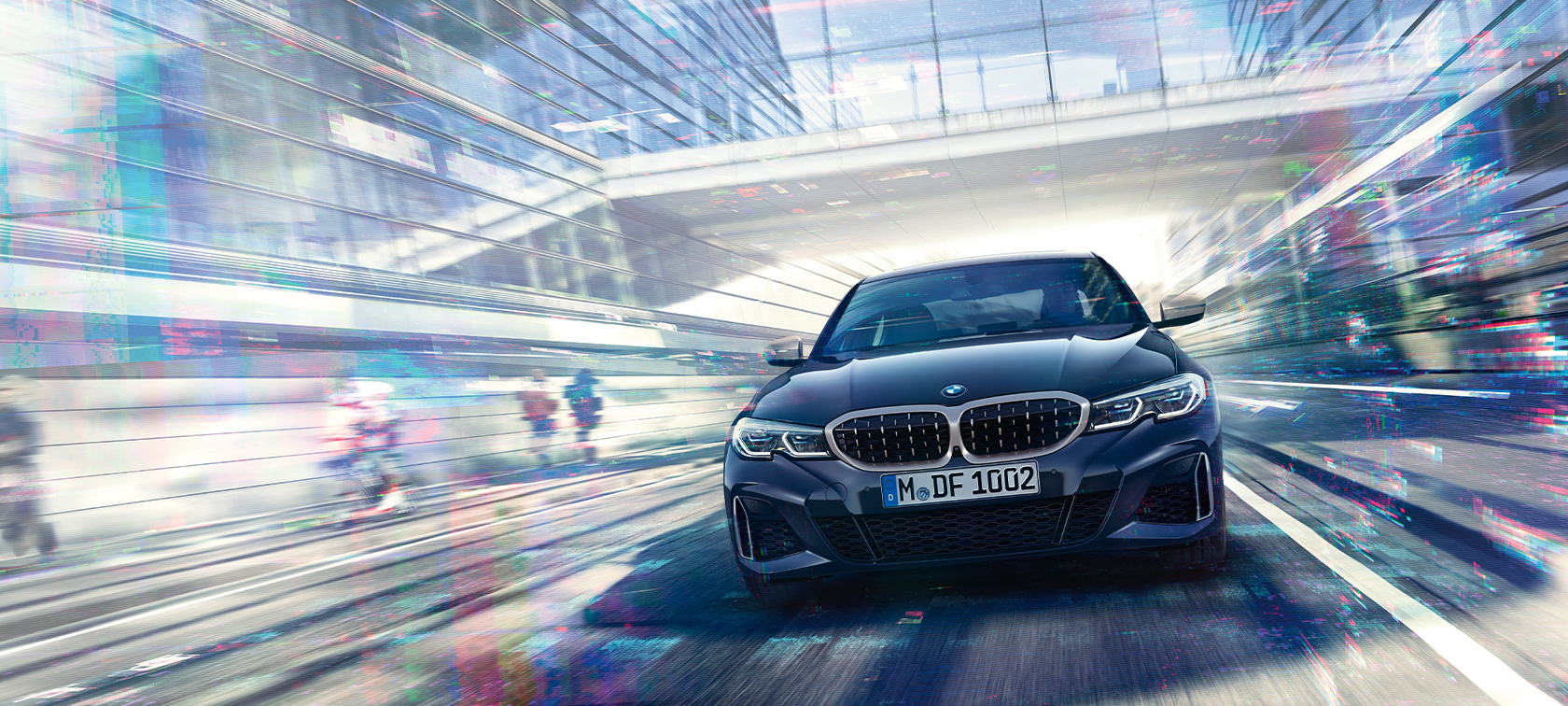Front view BMW M340i xDrive Sedan BMW M340i xDrive Sedan G20 Sapphire Black metallic front view while driving