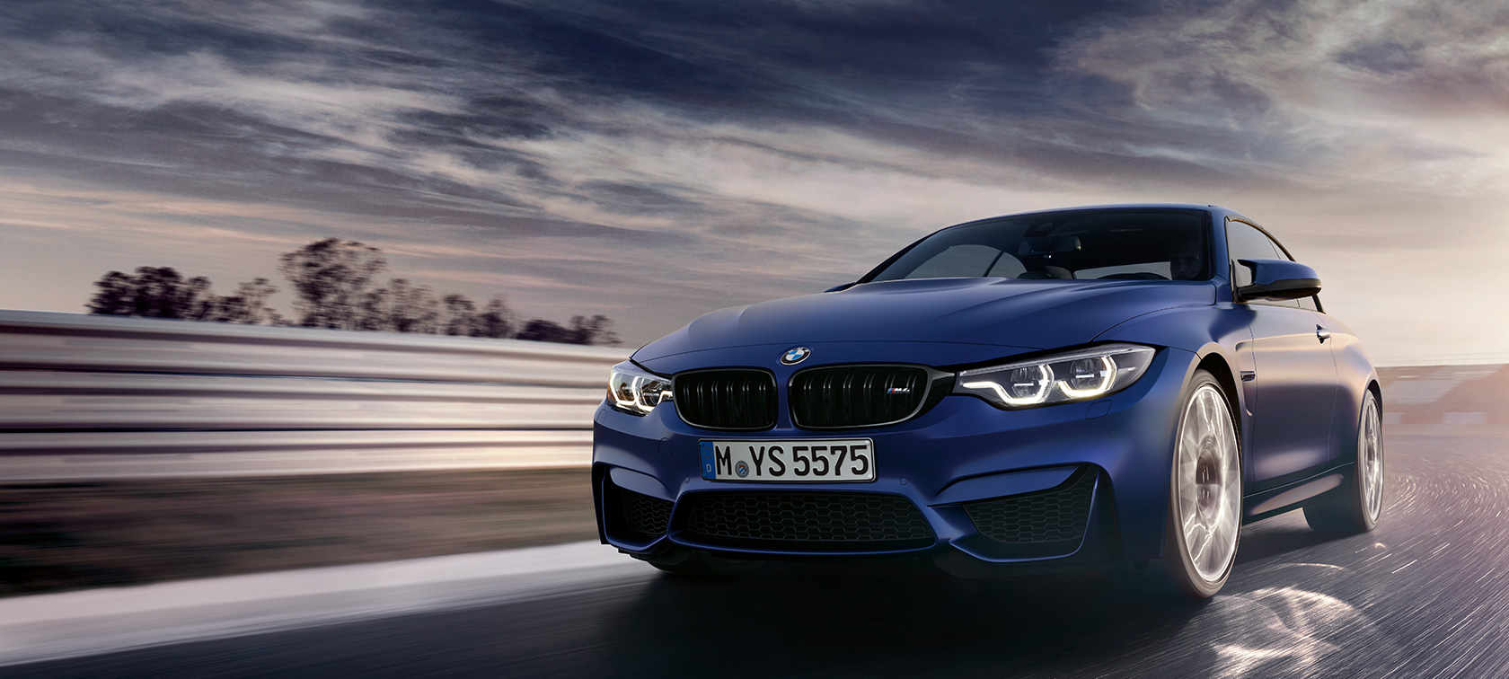 BMW M4 Convertible BMW M4 Convertible, three-quarter front view while driving on a racetrack