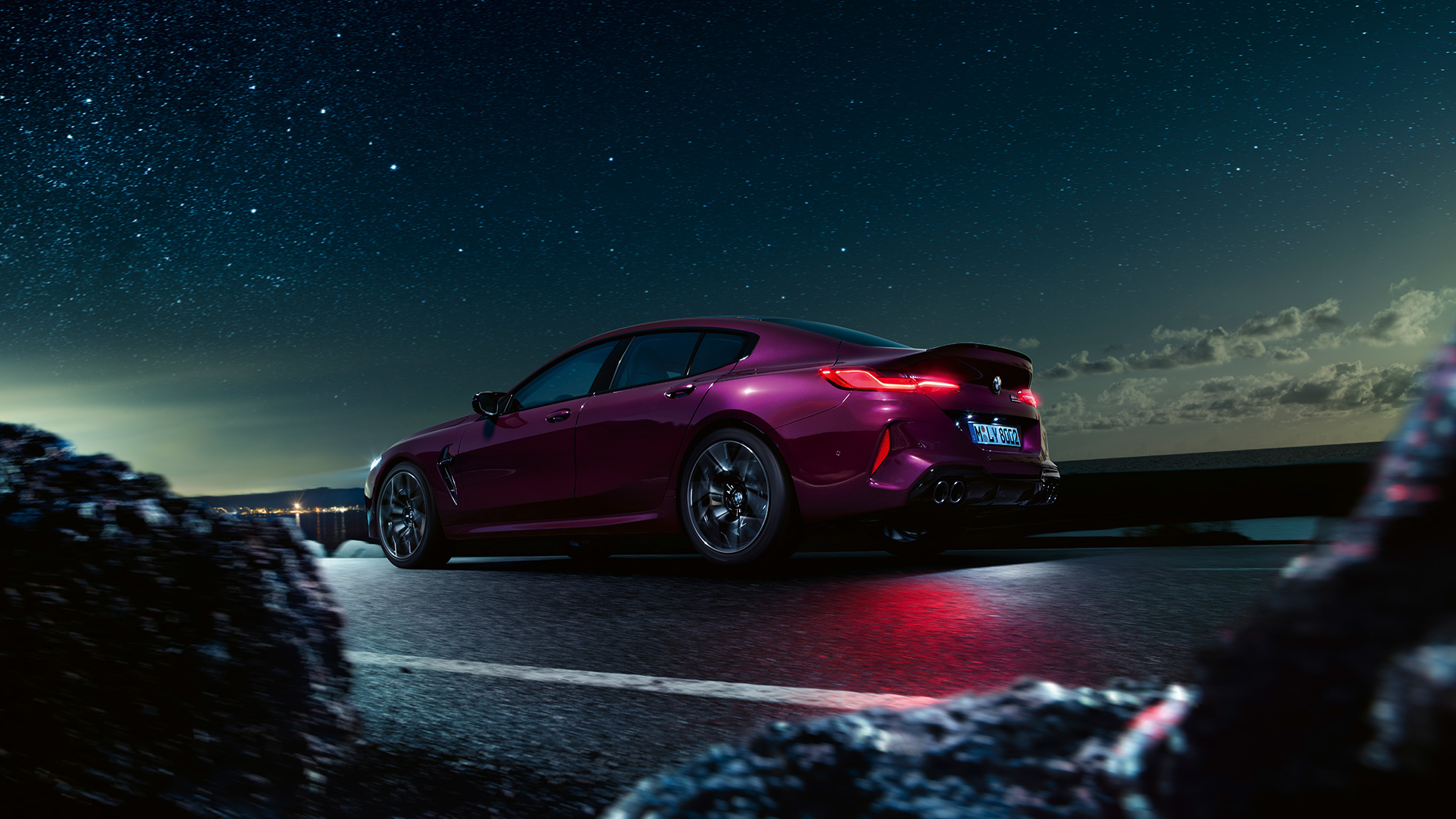 BMW M8 Competition Gran Coupé three-quarter rear view low angle shot BMW M8 Competition Gran Coupé F93 2020 BMW Individual Ametrine metallic three-quarter rear view low angle shot