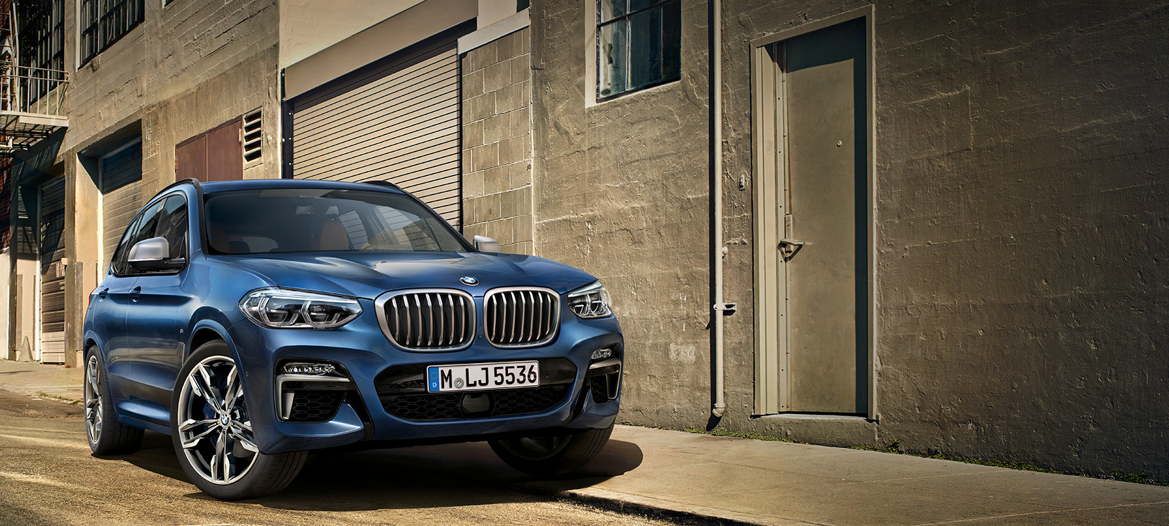 BMW X3 M40i, shot in front of house wall BMW X3 M40i, shot in front of house wall