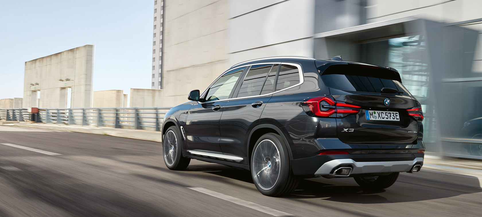 BMW X3 G01 three-quarter rear view driving 2021 BMW X3 G01 three-quarter rear view driving 2021