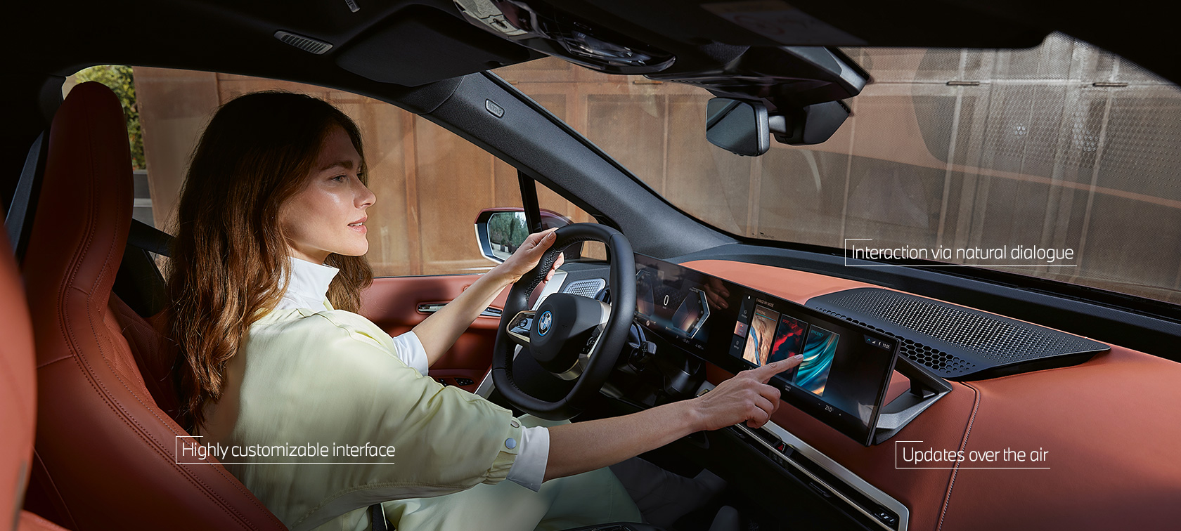 Woman uses MyModes from BMW iDrive via touch control Woman uses MyModes from BMW iDrive via touch control