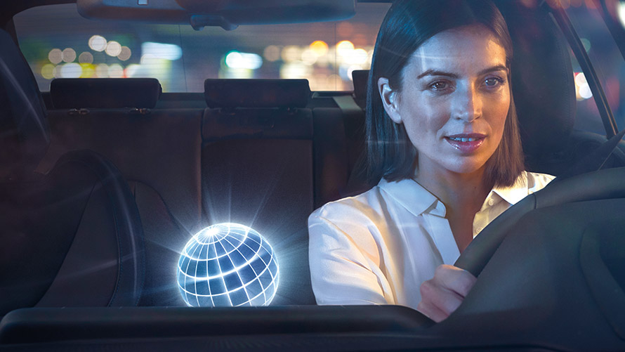 BMW Intelligent Personal Assistant, Natural Interaction Woman driving in BMW in nocturnal setting