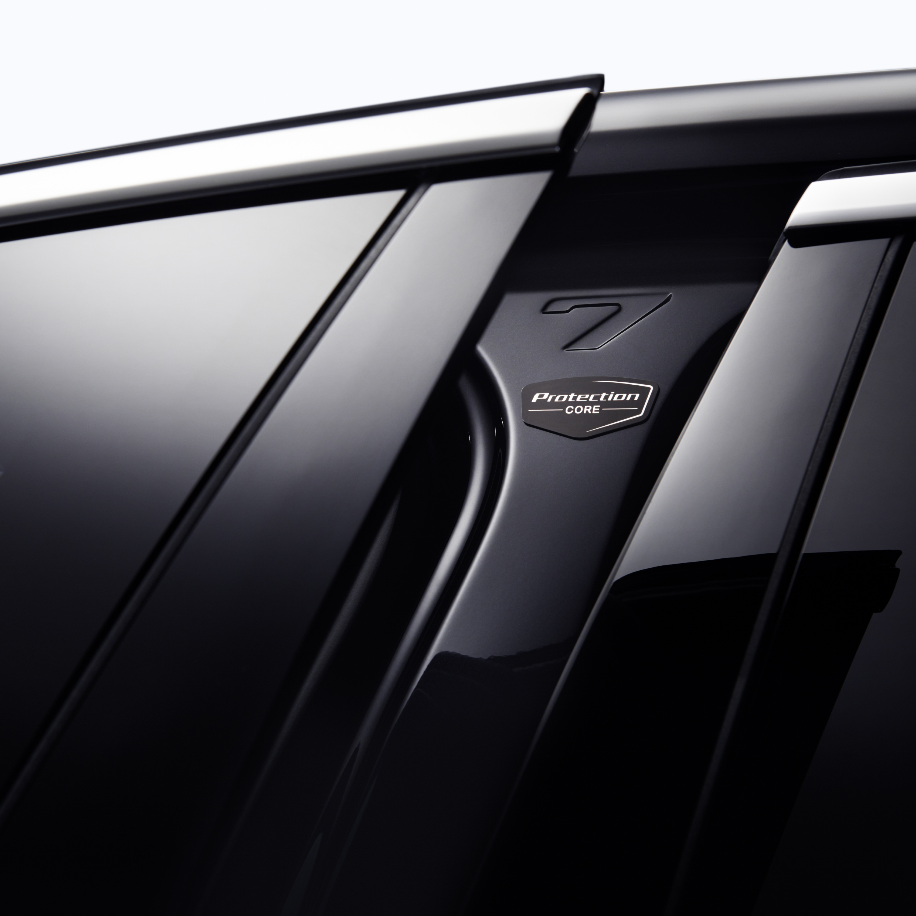 Close-up of the door of an armoured passenger cell with “Protection Core” logo